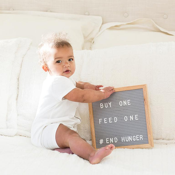 Baby Holding Letterboard