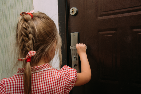 child opens door video doorbell camera