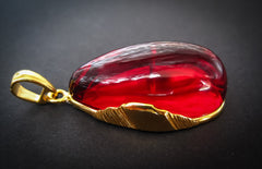 gold plated pendant with red amber