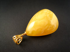 gold plated pendant with yellow amber