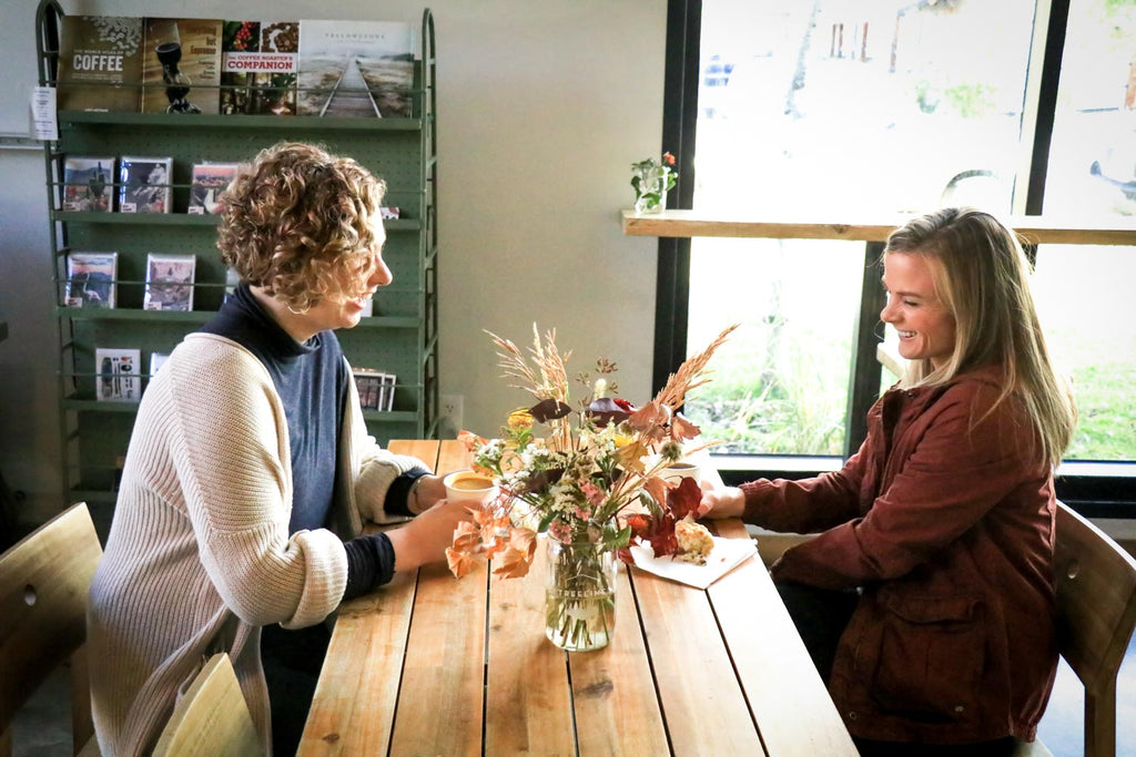 Two women connecting with no technology in sight over a table