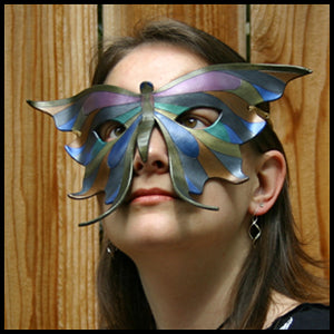 Erin of Eirewolf Creations, wearing one of her handmade leather butterfly masks.