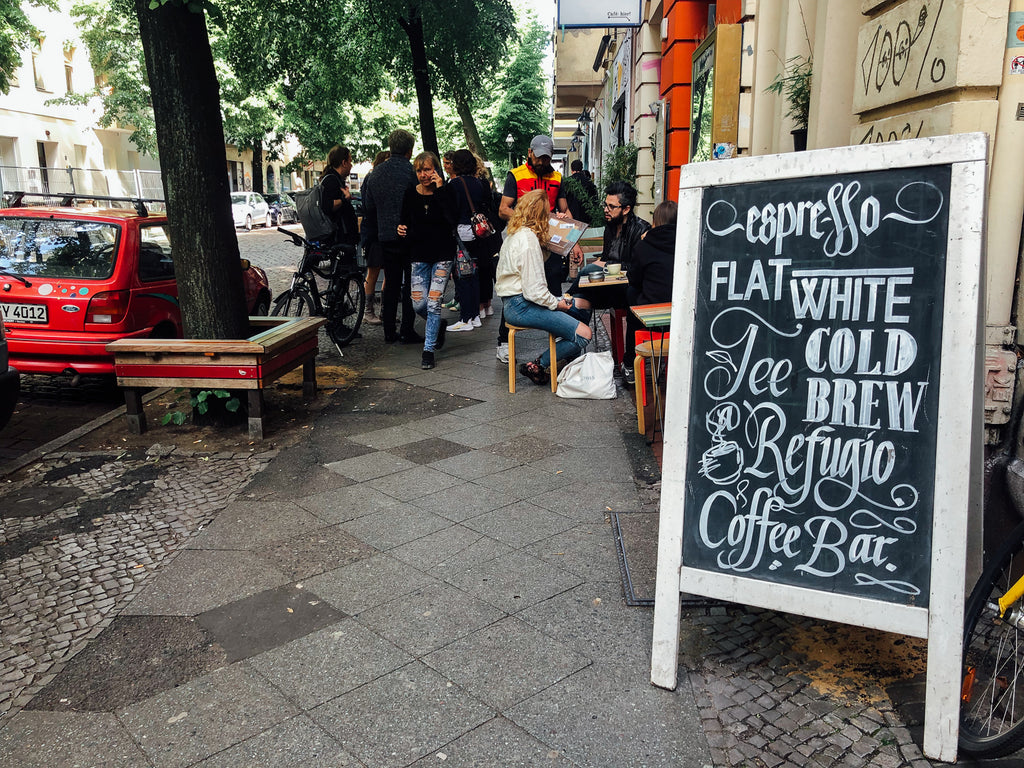 the street and A board outside the cafe