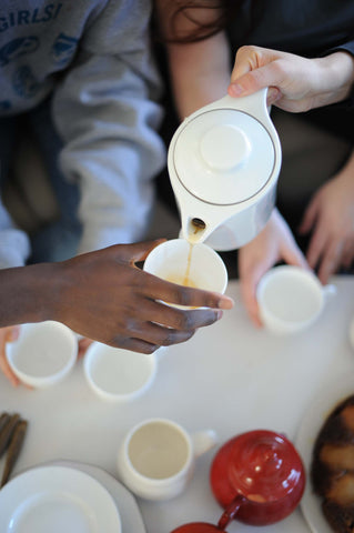 Teens relax and enjoy tea