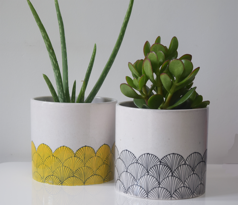 Yellow and black and white blue pottery planters