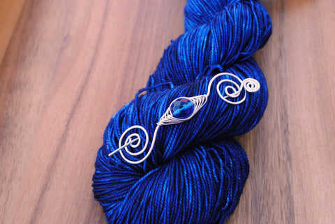 Sapphire yarn by Knitting Notions with my September birthstone shawl pin at Wisconsin Sheep & Wool Festival 2018!