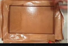 Spray painted cabinet door with Rust-Oleum Hammered Copper