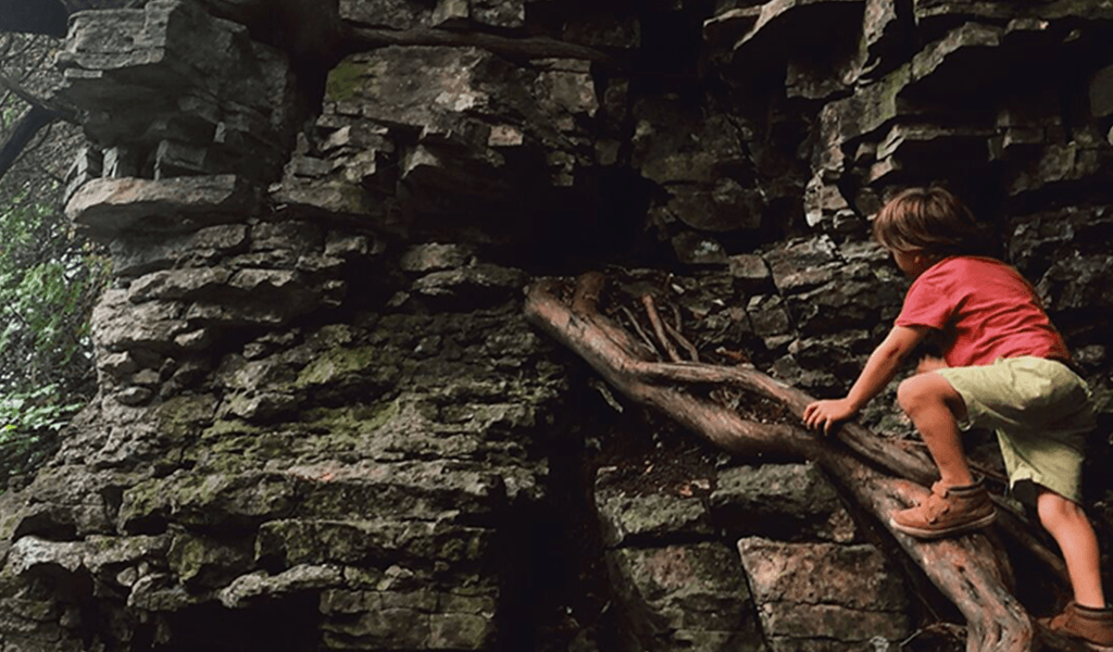 boy-climbing-rocks-door-county-wi