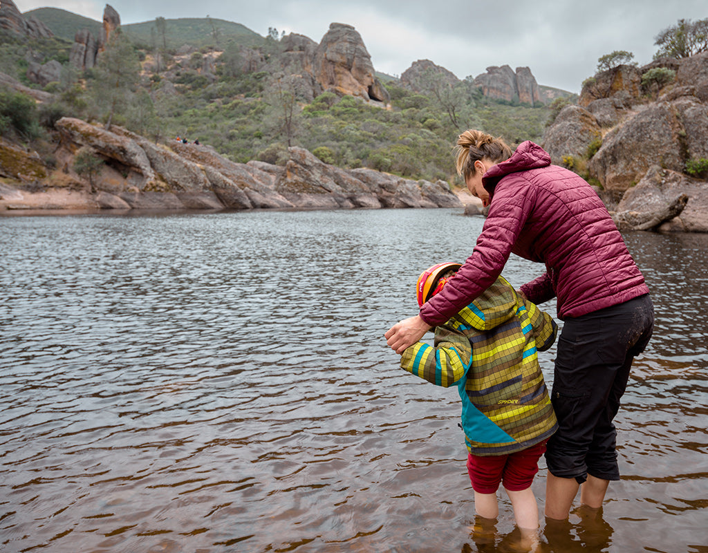 boy and woman wading in bear gulch reservoir