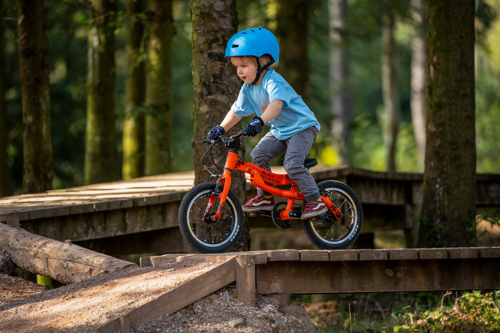 Child on mountain bike course