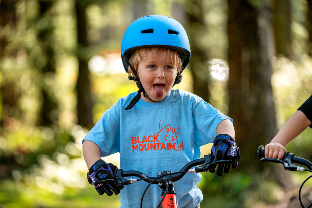 Boy on bike smiling