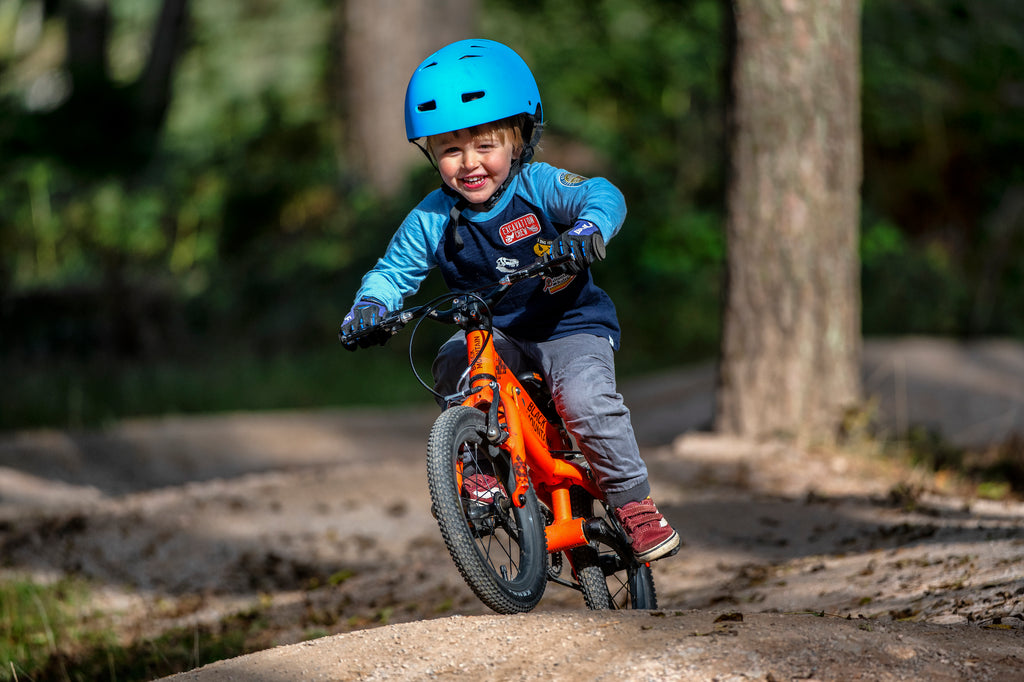 Boy riding trails on lightweight kids bike