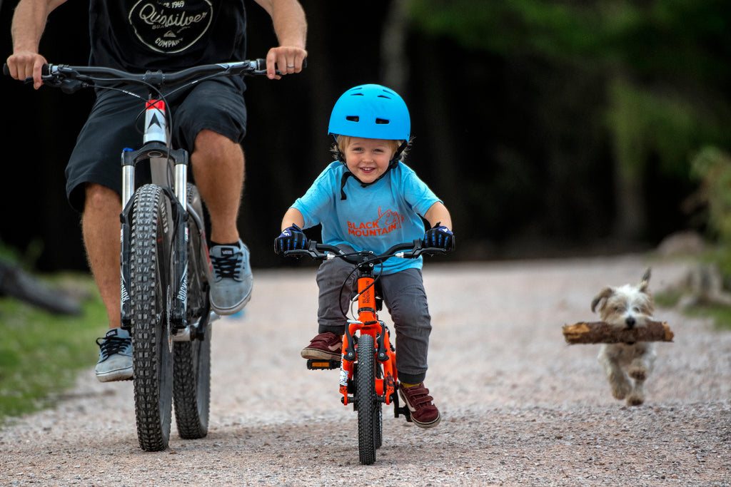 Dad and son riding mountain bikes