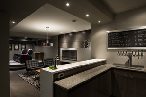 View from the basement bar into the lounge and home theater areas