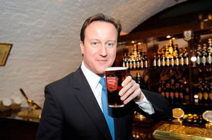 British Prime Minister Mr. Cameron enjoying a pint of Pride in the Hock Cellar tasting room at Fuller's brewery