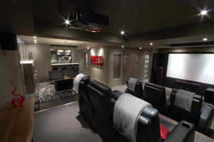 View across the basement home theater into the lounge and bar