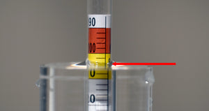 A hydrometer reading is taken where the water is at its lowest point (called the meniscus)