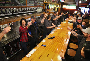 Russian River Brewing Company owners Natalie and Vinnie Cilurzo raise glasses of Pliny the Younger with their staff before opening their doors to customers in Santa Rosa, on Friday, February 3, 2017