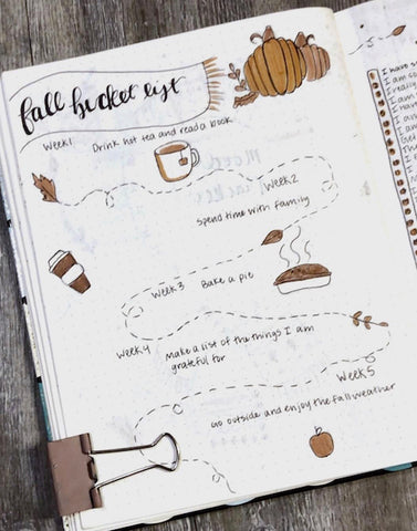 15 Fall Bullet Journal Ideas- Make your bujo beautiful this fall with inspiration from these 15 fall bullet journals! There are so many beautiful autumn-themed weekly spreads, trackers, and more to try! | autumn bullet journal pages, fall planner ideas, #bulletJournal #bujo #bulletJournalLayout #planner #DigitalDownloadShop