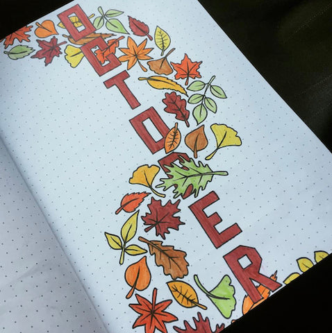 Fall Bullet Journal Cover- Make your bujo beautiful this fall with inspiration from these 15 fall bullet journals! There are so many beautiful autumn-themed weekly spreads, trackers, and more to try! | autumn bullet journal pages, fall planner ideas, #bulletJournal #bujo #bulletJournalLayout #planner #DigitalDownloadShop
