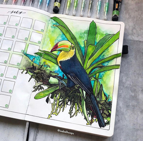 Toucan Bullet Journal Calendar- Get your bullet journal ready for summer with these gorgeous summer bujo ideas! You have to see these inspiring summery trackers, layouts, covers, and more! | #bulletJournal #bujo #bujoIdeas #bujoInspiration #DigitalDownloadShop