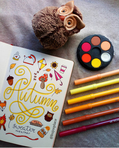 Autumn Bullet Journal Cover- Make your bujo beautiful this fall with inspiration from these 15 fall bullet journals! There are so many beautiful autumn-themed weekly spreads, trackers, and more to try! | autumn bullet journal pages, fall planner ideas, #bulletJournal #bujo #bulletJournalLayout #planner #DigitalDownloadShop