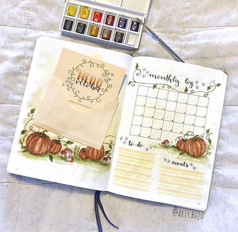 Pumpkin Bullet Journal Spread- Make your bujo beautiful this fall with inspiration from these 15 fall bullet journals! There are so many beautiful autumn-themed weekly spreads, trackers, and more to try! | autumn bullet journal pages, fall planner ideas, #bulletJournal #bujo #bulletJournalLayout #planner #DigitalDownloadShop