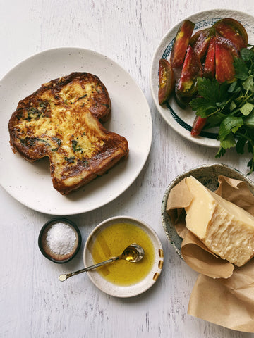 Savory french toast with tomatoes, parmesan, and herbs