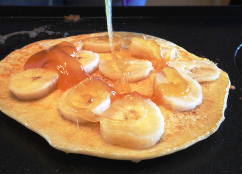 Crepe with banana slices and honey
