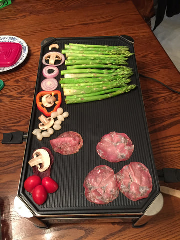 Meat and Veggies grilling on the raclette