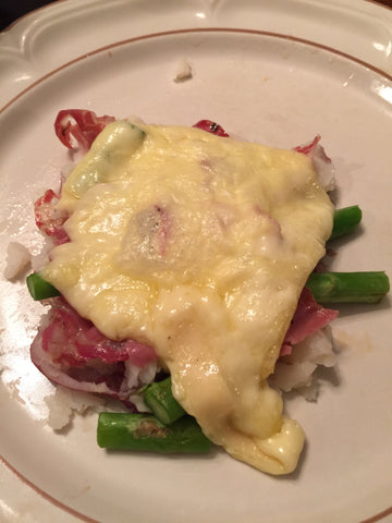 Grilled meat and veggies smothered in raclette cheese 