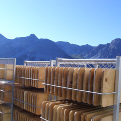 Cheese boards drying and sanitizing in the sun