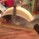 Raclette Holder "Flame" with half wheel of raclette cheese