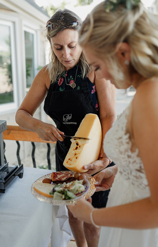 The bride is being served raclette first