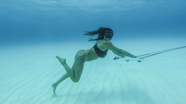 girl running under water with subwing