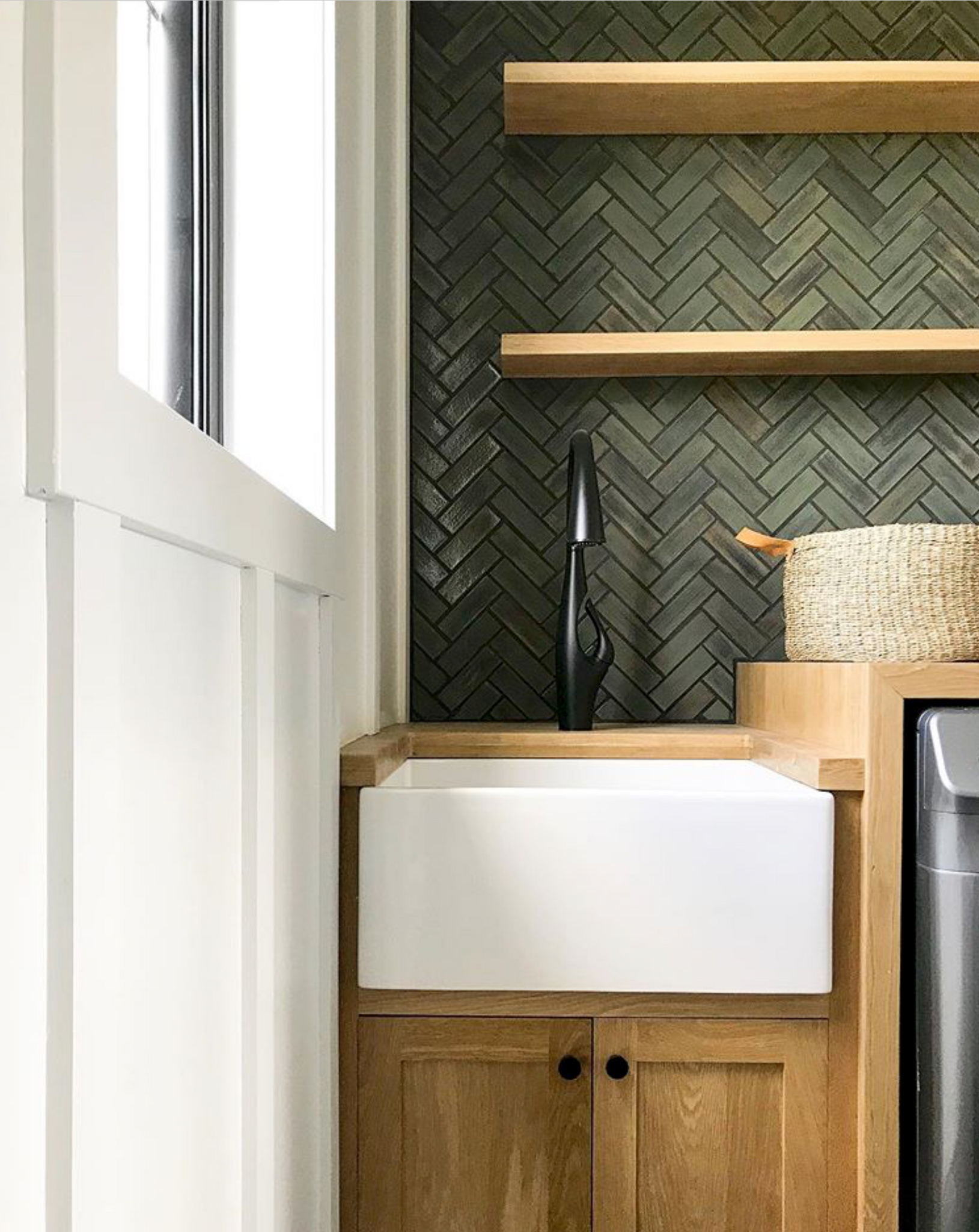 Matte Herringbone Tile Laundry Backsplash