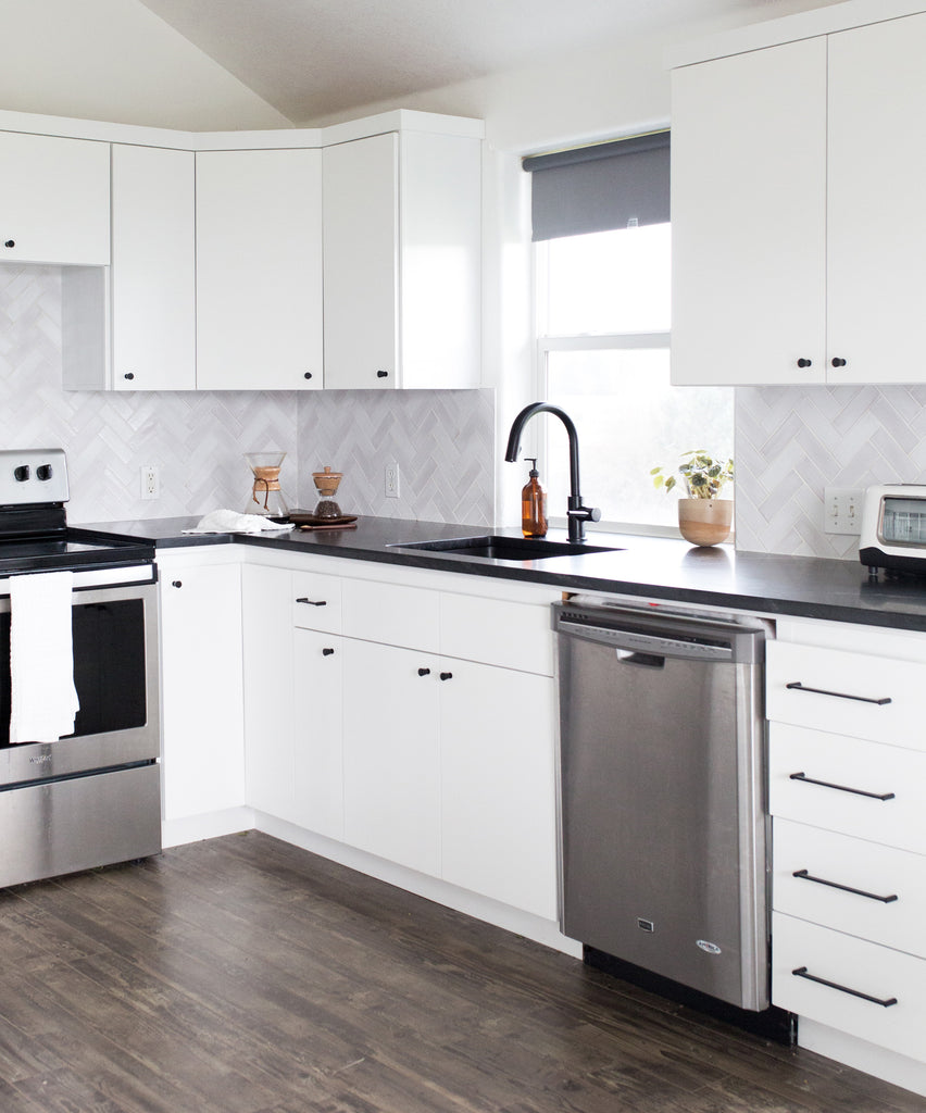 white herringbone kitchen tile backsplash