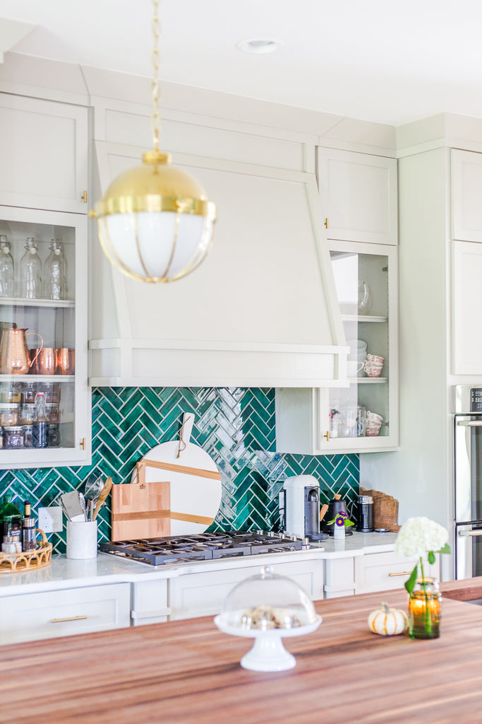 teal herringbone backsplash