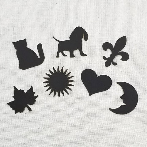assorted match striker shapes - cat, dog, fleur de lis, maple leaf, sunburst, heart, moon