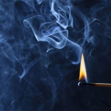 matchstick burning with smoke going up