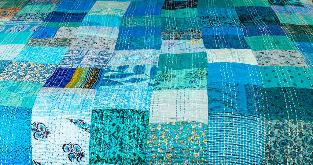 Kingfisher blue silk patchwork bedspread
