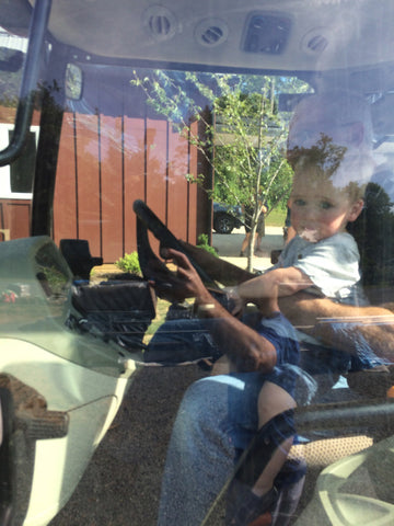 photo of grandson in tractor