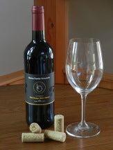 photo of red wine in bottle