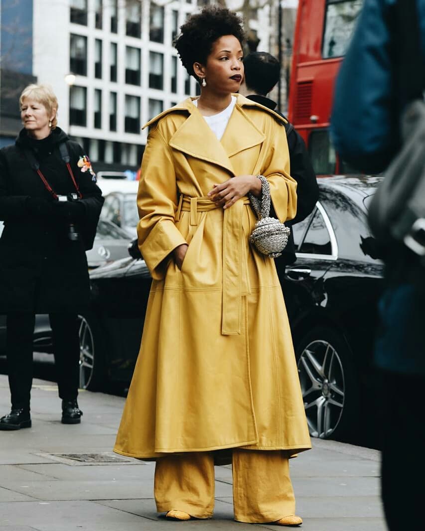 Slip Into Style influencer blogger Ellie Erdem Autumn Winter 2019 show wearing Mae Cassidy at London Fashion Week street style statement styling Silver Simi Sparkle clutch bag white tee head to toe colour Mustard yellow.