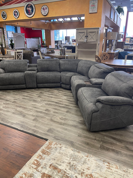 Refresh your living areas with this gray leather sectional a perfect match for your contemporary decor. 