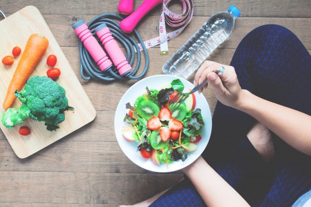 Person eating salad.