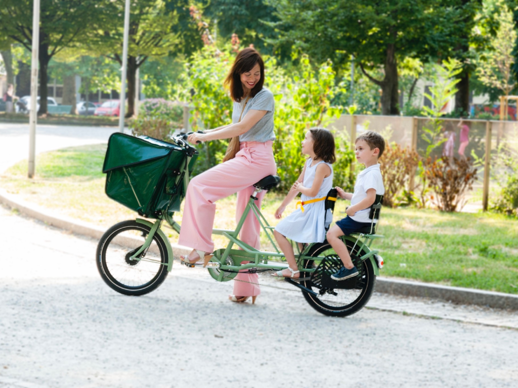 mariangela with her children in a bike