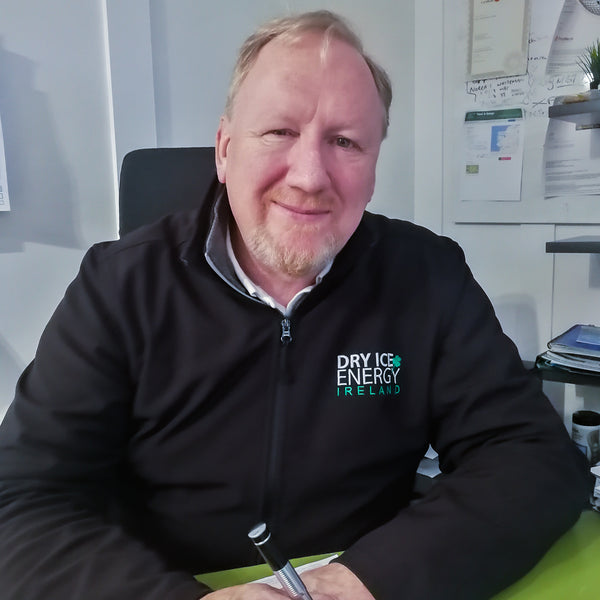 Peter Monahan founder and CEO sitting at his desk