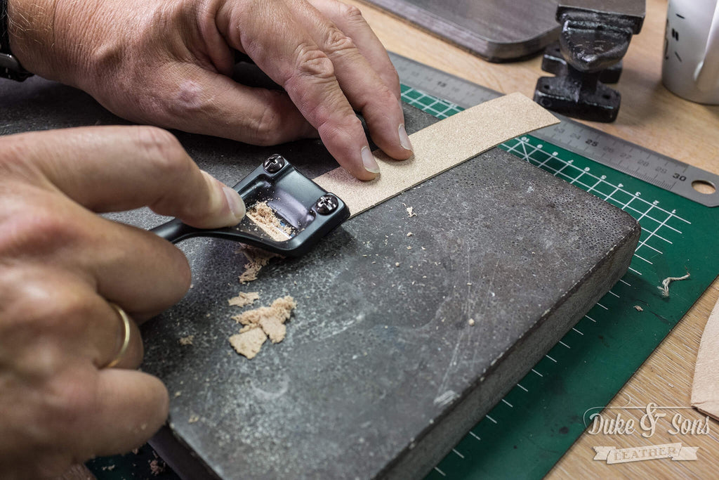 Skiving the end parts of the buckle strap because they are folded together