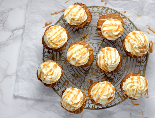 a dozen butternut squash cupcakes with vanilla bean frosting 